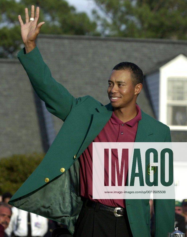U.S. - KRT SPORTS STORY SLUGGED: MASTERS KRT PHOTO BY JASON CLARK THE STAMP (April 14) AUGUSTA, GA -- Tiger Woods waves to the crowd wearing his Masters green jacket, his third Masters title and second consecutive. (KRT) NC KD BL 2002 (Vert) (gsb) News Archive - April 12, 2002 - ZUMAm67