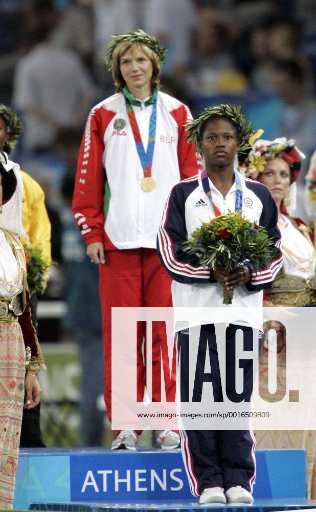 Aug. 21, 2004 - U.S. - KRT SPORTS STORY SLUGGED: OLY-TRACK KRT PHOTO BY RON CORTES PHILADELPHIA INQUIRER (August 22) ATHENS, GREECE -- Lauryn Williams, right, of the United States gets her silver medal in the 100 meters next to gold medalist Yuliya Nesterenko of Belarus at the 2004 Olympic Games on Sunday, August 22, 2004. (gsb) 2004 News Archive - Aug. 21, 2004 - ZUMAm67