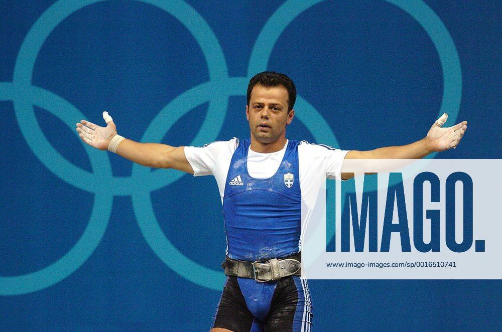Aug. 14, 2004 - U.S. - KRT SPORTS STORY SLUGGED: OLY-WEIGHTLIFTING KRT PHOTO BY PATRICK SCHNEIDER CHARLOTTE OBSERVER (August 16) ATHENS, GREECE -- Leonidas Sampanis of Greece acknowledges the crowd after clinching the bronze medal in the men s 62kg weightlifting competition Monday, August 16, 2004, during the 2004 Olympic Games. (gsb) 2004 News Archive - Aug. 14, 2004 - ZUMAm67