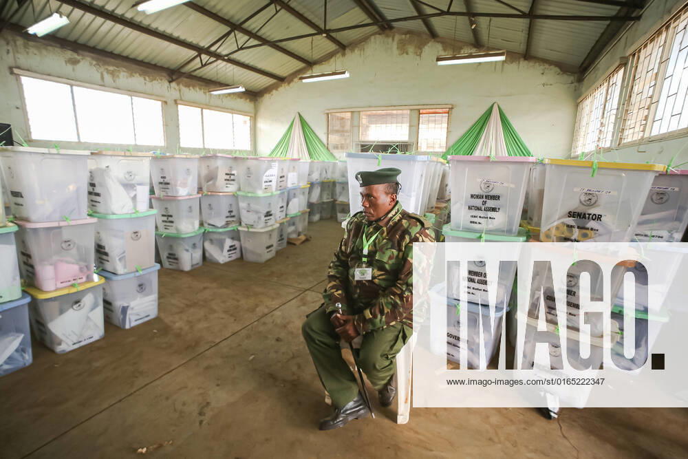 A Kenyan police officer watches over ballot boxes as tallying of results continue at Mathare Constituency tallying center in Nairobi. Tallying of results continue from Kenyas general elections which was held on 9th August 2022. Nairobi Kenya - ZUMAs197 20220811_zab_s197_046