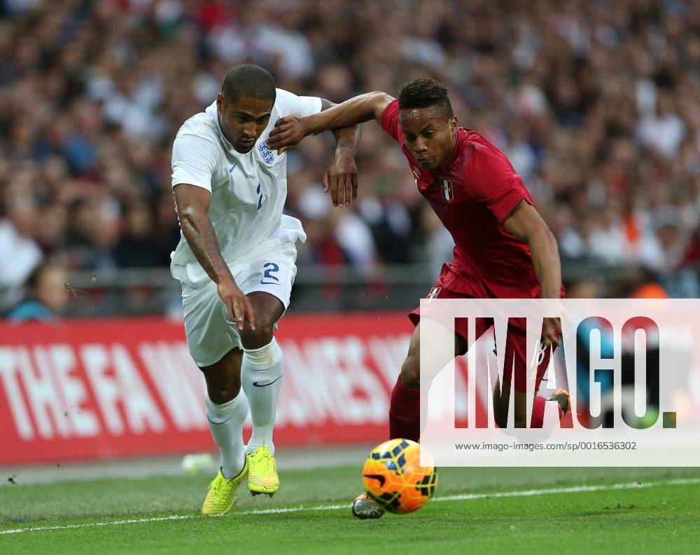 England s Glen Johnson tussles with Peru s Andre Carrillo England v Peru - International Friendly - Wembley Stadium- London - England - 30 05 2014 - Pic David Klein Sportimage .