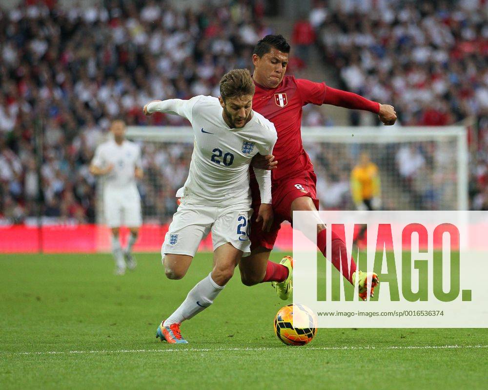 England s Adam Lallana tussles with Peru s Rinaldo Callens England v Peru - International Friendly - Wembley Stadium- London - England - 30 05 2014 - Pic David Klein Sportimage .