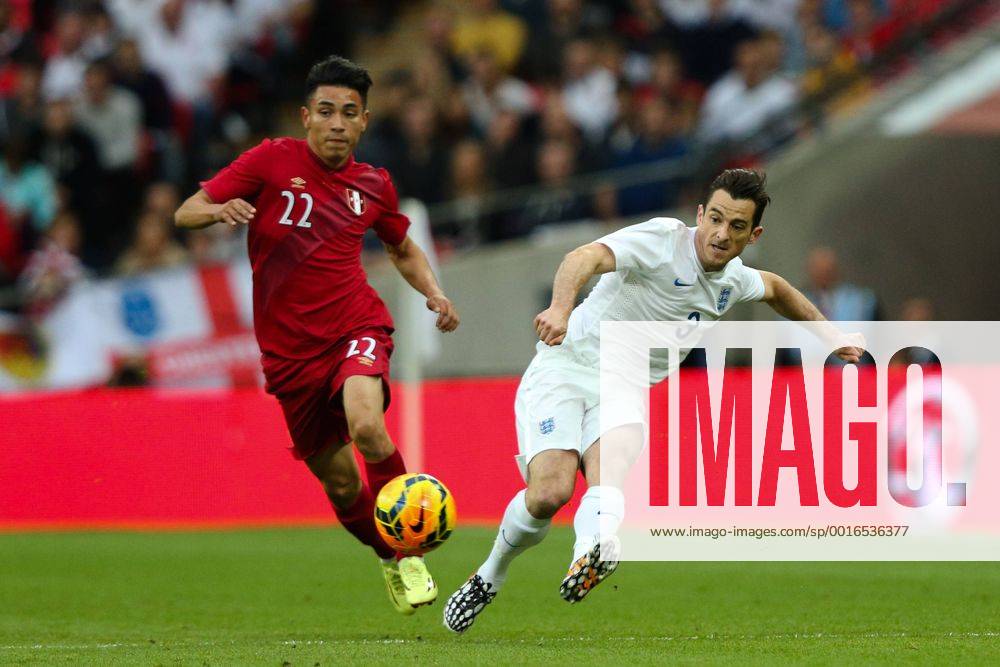 England s Leighton Baines and Peru s Jean Deza - International Friendly - England vs Peru - Wembley Stadium - London - 30 05 2014 - Pic Charlie Forgham-Bailey Sportimage .