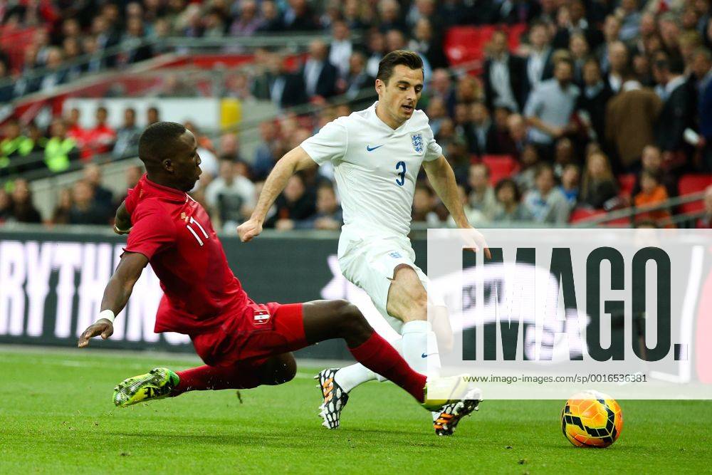 England s Leighton Baines and Peru s Luis Advincula - International Friendly - England vs Peru - Wembley Stadium - London - 30 05 2014 - Pic Charlie Forgham-Bailey Sportimage .