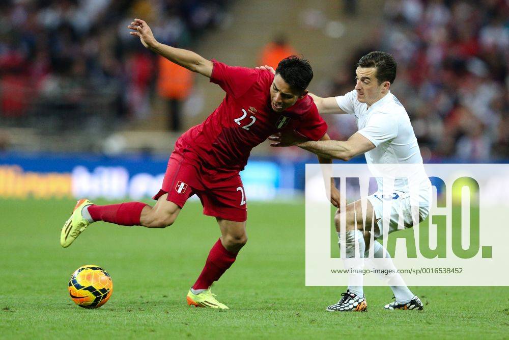 England s Leighton Baines and Peru s Jean Deza - International Friendly - England vs Peru - Wembley Stadium - London - 30 05 2014 - Pic Charlie Forgham-Bailey Sportimage .