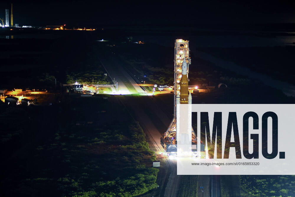 NASA s SLS rocket and Orion spacecraft roll from the Vehicle Assembly Building to Complex 39B at the Kennedy Space Center, Florida on Tuesday, August 16, 2022. The booster and spacecraft have been prepared for the maiden flight of the Artemis Program. The un-crewed test flight will pave the way for future crewed missions to the moon and beyond KSP20220816030 JOExMARINO