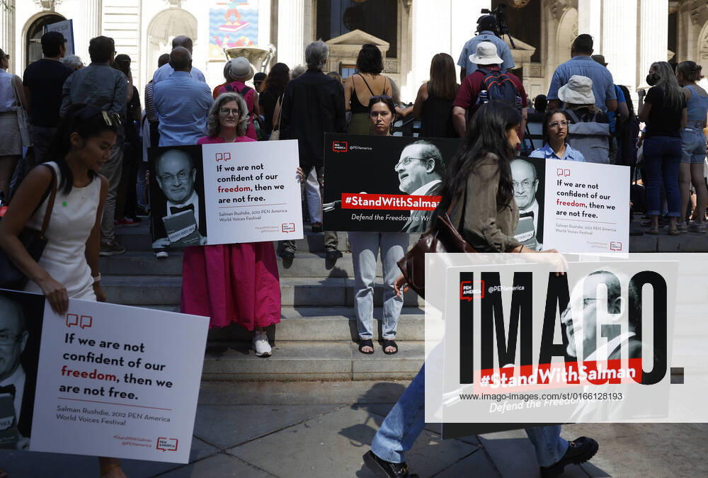 Supporters of author Salman Rushdie hold signs when they attend a New York literary event rally held in support of Salman Rushdie following last week s attack on Friday, August 19, 2022 at The New York Public Library in New York City. Rushdie was stabbed on stage in New York on August 12th and remains in critical condition. NYP20220819127 JohnxAngelillo