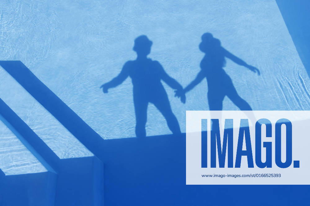 Shadow of couple holding hands seen on water of swimming pool model released, Symbolfoto property released, MAEF13074