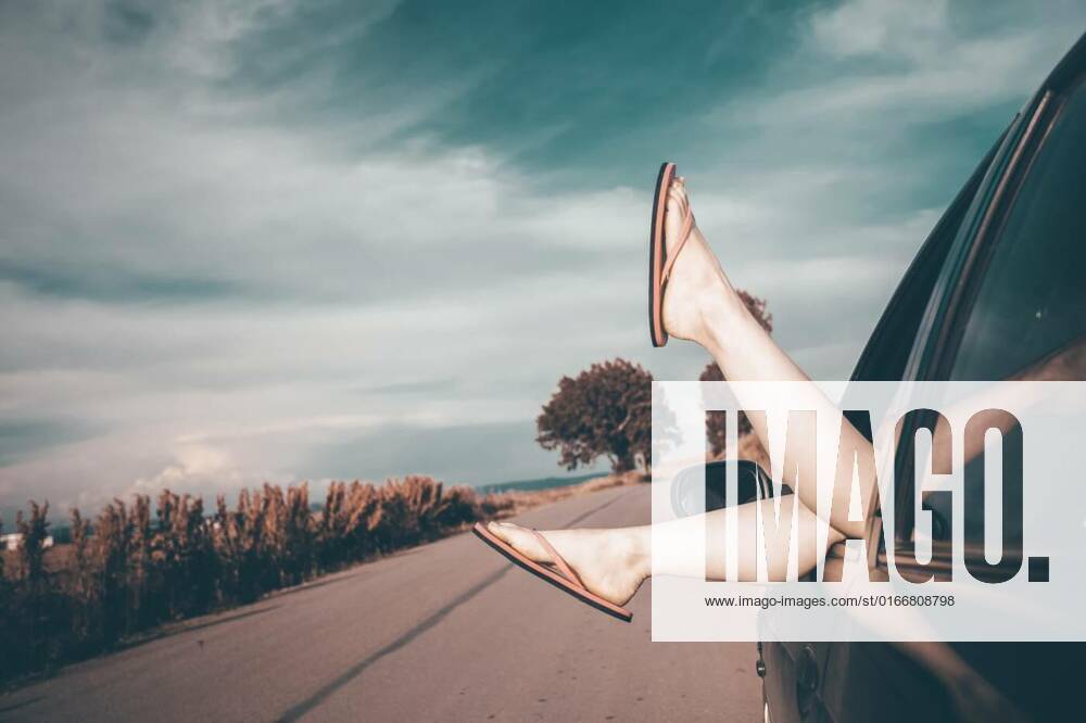 Summer travel concept with legs of a woman and car., Woman s legs out of car windows.Freedom, travel and vacation road trip concept lifestyle image., Woman s legs out of car windows.Freedom, travel and vacation road trip concept lifestyle image., 23.04.2021,
