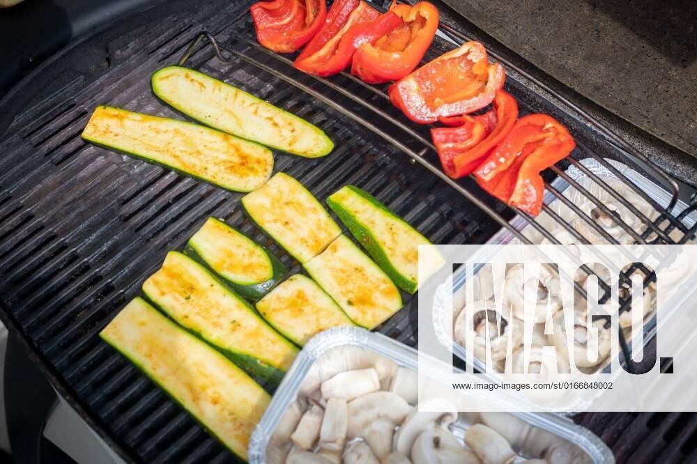 Vegetarian BBQ on weekend. Grill cheese and vegetables on gas grill. Outdoors., Close up of cheese and vegetables on gas grill. Summer time, outdoors., 02.05.2021,