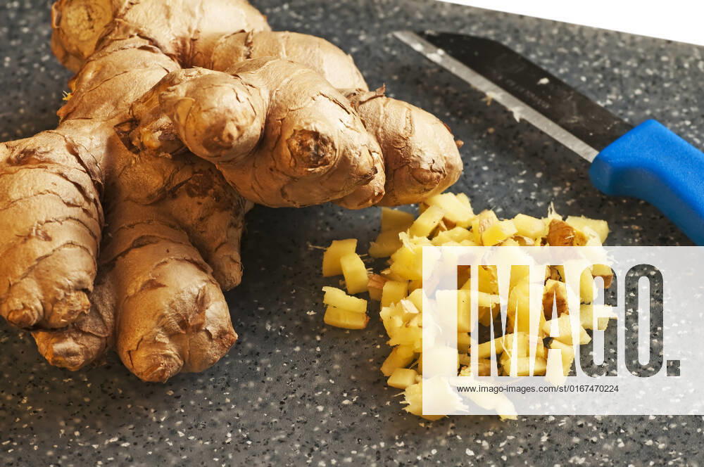 Sliced ginger , 3191511.jpg, asian, board, carving, chef, Chinese, chop, chopping, closeup, cook, cooking, cut, cutting, equipment, food, ginger, gourmet, half, hand, hands, ingredient, kitchen, knife, preparation, prepared, sharp, slice, spice, steel, tool, vegetable, white, wood, wooden, work,
