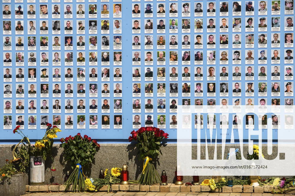 Day Of Remembrance Of Fallen Defenders Of Ukraine In Kyiv Flowers lay near the Memory Wall of the Fallen Defenders of Ukraine in the russian - Ukrainian war during a commemorative ceremony to mark the Day of Remembrance of Fallen Defenders of Ukraine in Kyiv, Ukraine August 29, 2022 Kyiv Ukraine