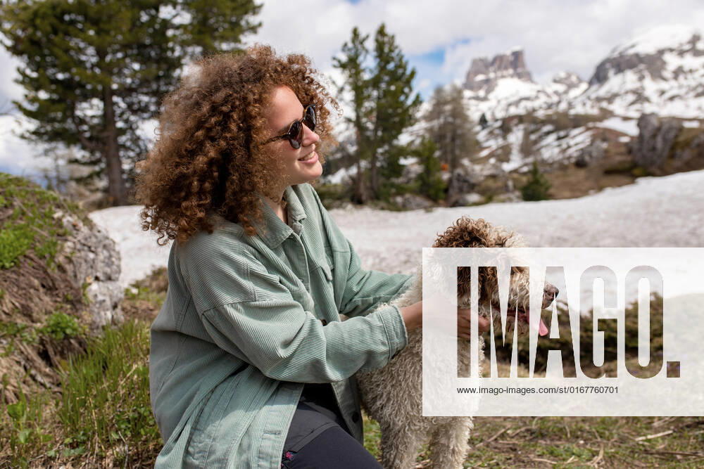 Animal love,stroking,spanish water dog,animal loves,perro de agua espanol 539-ilh ,model released, Symbolfoto