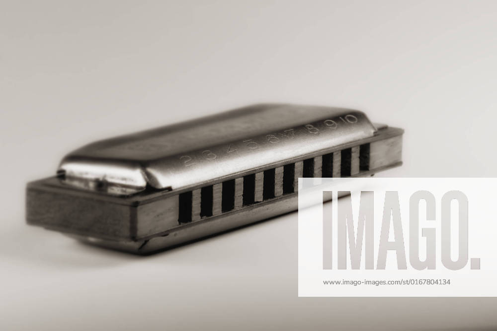 Close up of blues harmonica , shallow DOF retro style toned photo , 4031158.jpg, aged, audio, band, blow, blues, brass, country, diatonic, draw, folk, harmonica, harp, instrument, instruments, isolated, jazz, metal, mouth, music, note, object, old, plate, pop, reed, retro, rock, studio, toned, used, vertical, vintage, white,