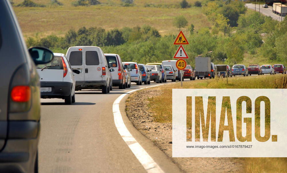 Maintains on country road in Serbia, slow moving cars row and traffic signs , 4180516.jpg, maintains, country, road, Serbia, slow, moving, vehicles, row, traffic, signs, speed, car, cars, vehicle, various, jam, transport, transportation, sign, sighs, triangle, round, forty, grass, sunlight, meadow, countryside, balkan, balkans, forward, direction, curve, slowing, lights, crowd, crowded, drive, driving, fuel, late, line, slowdown, time, wait, waiting, back, delay, automobile, automobiles, auto,