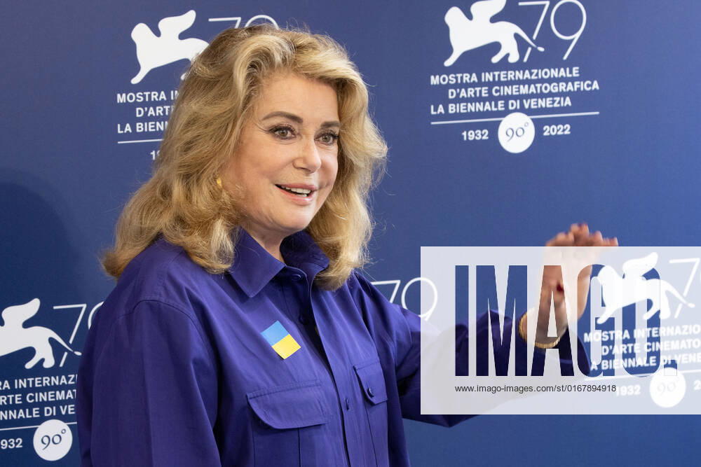 French actress Catherine Deneuve, wearing a flag of Ukraine on her shirt, poses on August 31, 2022, during a photocall for the Golden Lion for Lifetime Achievement she is to be awarded, on the opening day of the 79th Venice International Film Festival at Venice Lido. Ã‚ Photo: Cinzia Camela.