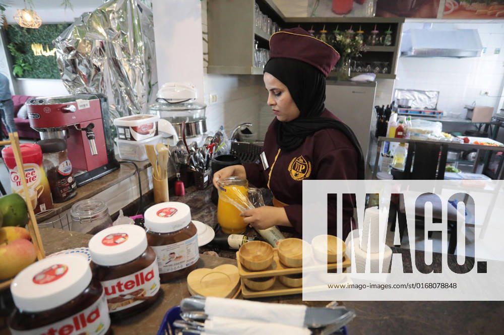 Palestinian women work at VIP Sabaya Cafe Palestinian women work at VIP Sabaya Cafe in Gaza city on September 4, 2022. VIP Sabaya Cafe is specialized to receive of the girls and women, the first of its kind in Gaza City, where only women work. Gaza’s 2.3 million people are suffering from a 15-year Israeli blockade. Photo by Ashraf Amra apaimages Gaza city Gaza Strip Palestinian Territory 040922_GAZA_ASH_00 (9)