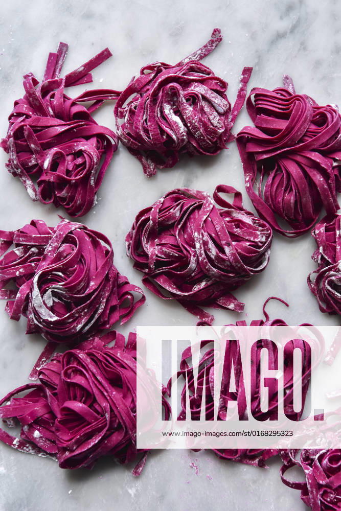 Homemade Beetroot Egg Pasta on a marble background Homemade Beetroot Egg Pasta on a marble background