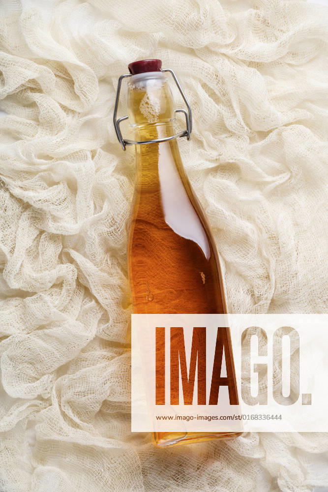 Fermented homemade drink, flat lay, healthy lifestyle concept Fermented homemade drink (kombucha, apple cider vinegar), flat lay