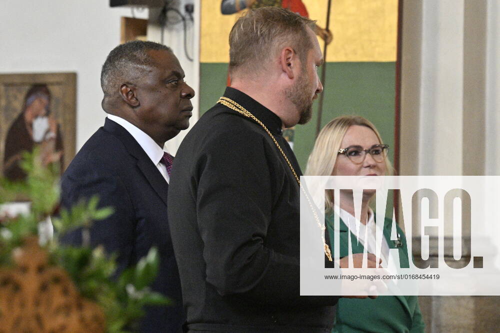 U.S. Secretary of Defense Lloyd Austin, left, and Czech Defence Minister Jana Cernochova, right, pay homage to the Czechoslovak paratroopers who killed Nazi Deputy Reichsprotector Reinhard Heydrich, Friday, Sept. 9, 2022, the Saint Cyril and Methodius Church, Prague, Czech Republic. At center is mayor of Prague 2 Alexandra Udzenija. (CTKxPhoto VitxSimanek) CTKPhotoP2022090902883