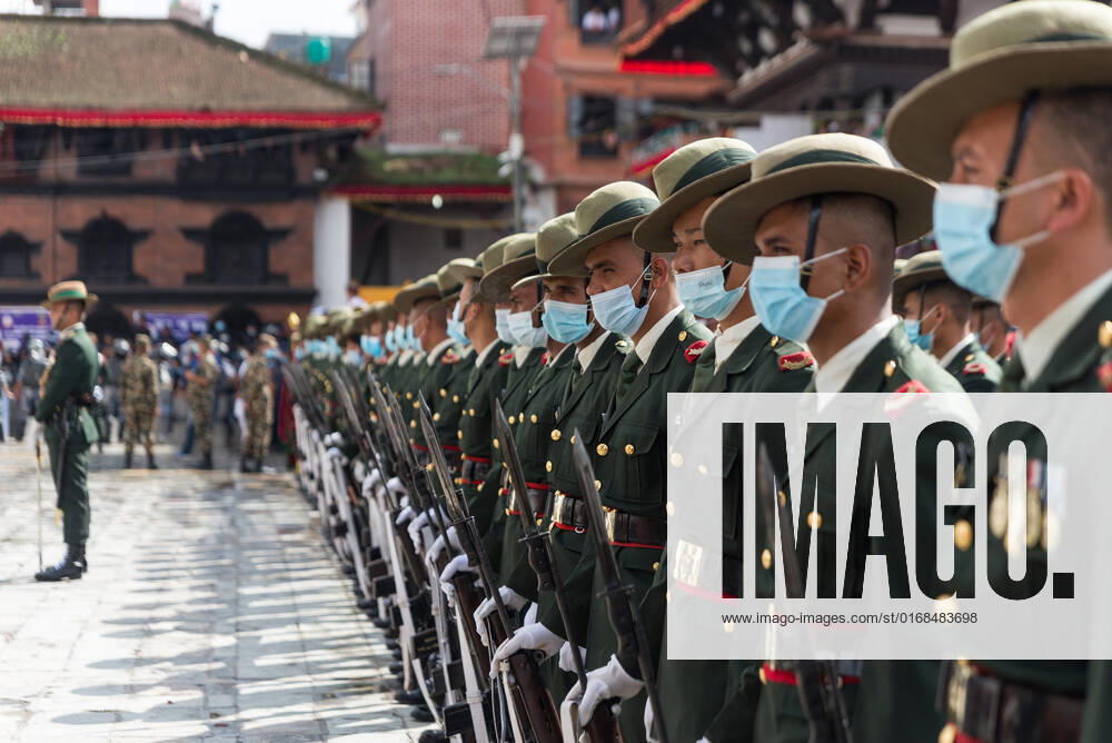 Army personnel parade during the procession in Hanuman Dhoka Durbar Square. People celebrate Indra Jatra festival to honor Indra, king of heaven and lord of rain, on the main day the chariot of god Kumari, Ganesh and Bhairav are pulled around the places of Basantapur. Kathmandu Nepal - ZUMAs197 20220909_zab_s197_071