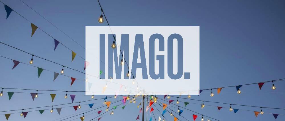 Garland with colorful pennants and light bulbs on pole over blue sky, Garland with colorful pennants and light bulbs on pole over blue sky. Long format, Garland with colorful pennants and light bulbs on pole over blue sky. Long format, 11.10.2021,