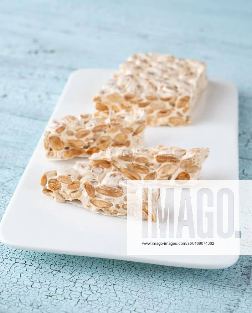 Turron - European nougat confection, Pieces of turron European nougat confection with almond, Pieces of turron European nougat confection with almond, 15.01.2022,