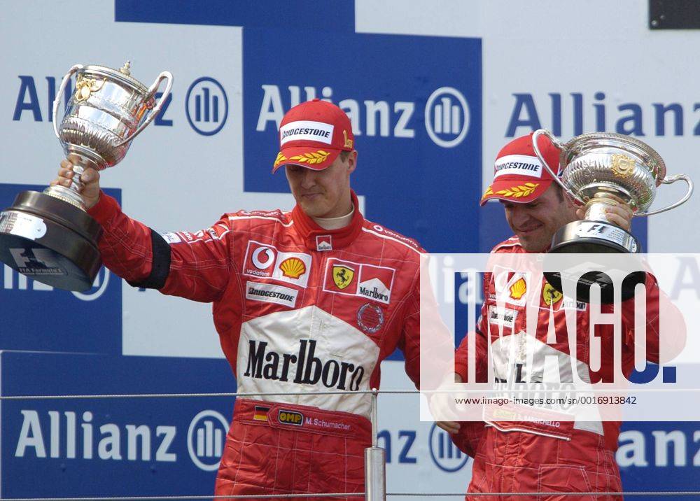 SCHUMACHER Michael Team Scuderia Ferrari Sieger Großer Preis von Europa 2004 auf dem Nürburgring.Sport Motorsport Formel 1 Siegeehrung mit Rubens Barrichello. Copyright