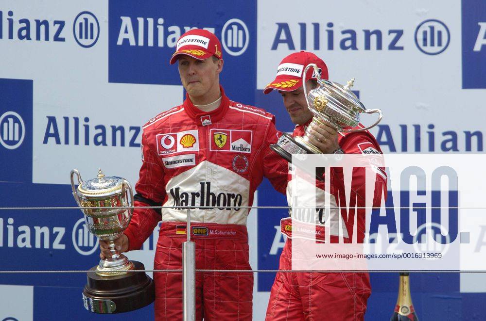 SCHUMACHER Michael Team Scuderia Ferrari Sieger Großer Preis von Europa 2004 auf dem Nürburgring.Sport Motorsport Formel 1 Siegeehrung mit Rubens Barrichello. Copyright
