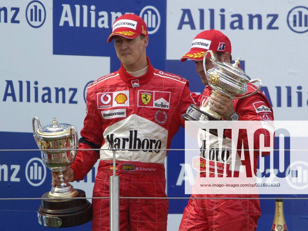 SCHUMACHER Michael Team Scuderia Ferrari Sieger Großer Preis von Europa 2004 auf dem Nürburgring.Sport Motorsport Formel 1 Siegeehrung mit Rubens Barrichello. Copyright