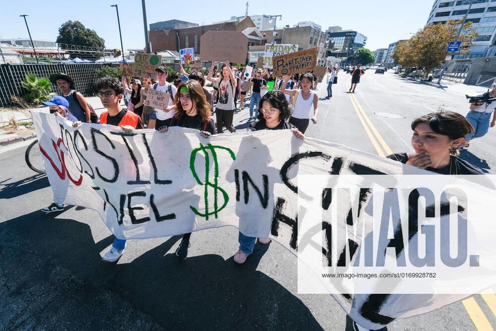 Climate protesters march with placards behind a banner during a Global Climate Strike rally in Los Angeles. Youth and community organizers gather as part of a worldwide Global Climate Strike to call for divestment from fossil fuels and investment in green infrastructure, and to highlight what it s like to suffer on the frontlines of environmental racism and the climate crisis. Los Angeles United States - ZUMAs197 20220923_zaa_s197_201