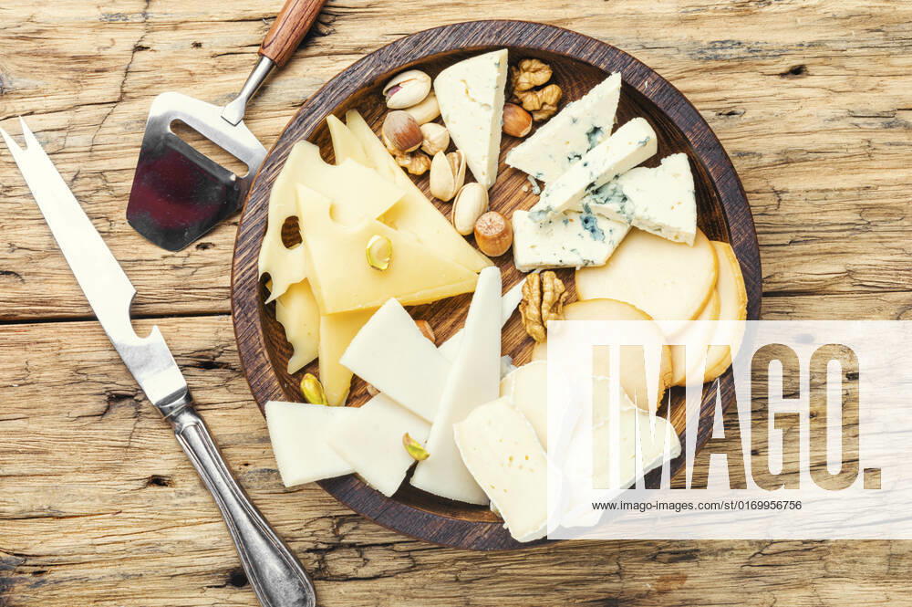 Cheese on the table.various types of cheese on old rustic wooden table , 28798426.jpg, different, cheese, piece, nut, kinds, assorted, slice, snack, healthy, cutting, appetizer, delicatessen, product, fresh, cut, parmesan, tasty, italian, cheddar, meal, food, brie, swiss, breakfast, assortment, milk, hole, eating, dairy, part, portion, holland, knife, set, dinner, tray, plate, cheese board, cheese platter, flavor, sliced, piece cheese, wooden, wooden table,
