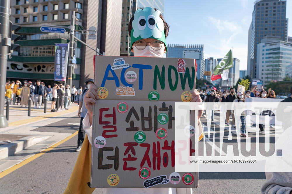 Climate Justice March In Seoul A protester holds a placard saying Act Now at Climate Justice March around Gwanghwamun area on September 24, 2022 in Seoul, South Korea. The demonstration demanded the government to stop using Fossil Energy system and climate justice. About 10,000 people by The Police s estimate (35,000 people by The Organizer s estimate) gathered at the demonstration on the day. Seoul South Korea