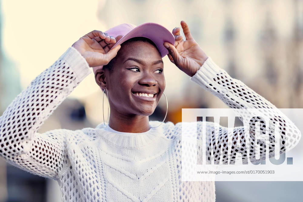 Cheerful young woman wearing pink cap model released, Symbolfoto, GGGF01180