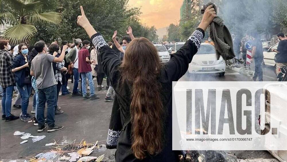 Sep 28, 2022 - Tehran, Tehran, Iran - This photo shows that Iranian women are on the front line of the protests and are fighting against the agents of repression. Mahsa Amini, a 22-year-old Iranian woman, was arrested in Tehran on 13 September by the morality police, a unit responsible for enforcing Iran s strict dress code for women. She fell into a coma while in police custody and was declared dead on 16 September, with the authorities saying she died of heart failure while her family advised that she had no prior health conditions. Her death has triggered protests in various areas in Iran and around the world. According to Iran s state news agency IRNA, Iranian President Ebrahim Raisi expressed his sympathy to the family of Amini on a ph - ZUMAi98_ 20220928_new_i98_477