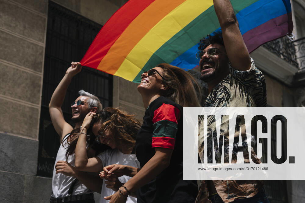Group of friends with a flag of gay pride in the city of Madrid JoseLuisCarrascosa_GayPride_9