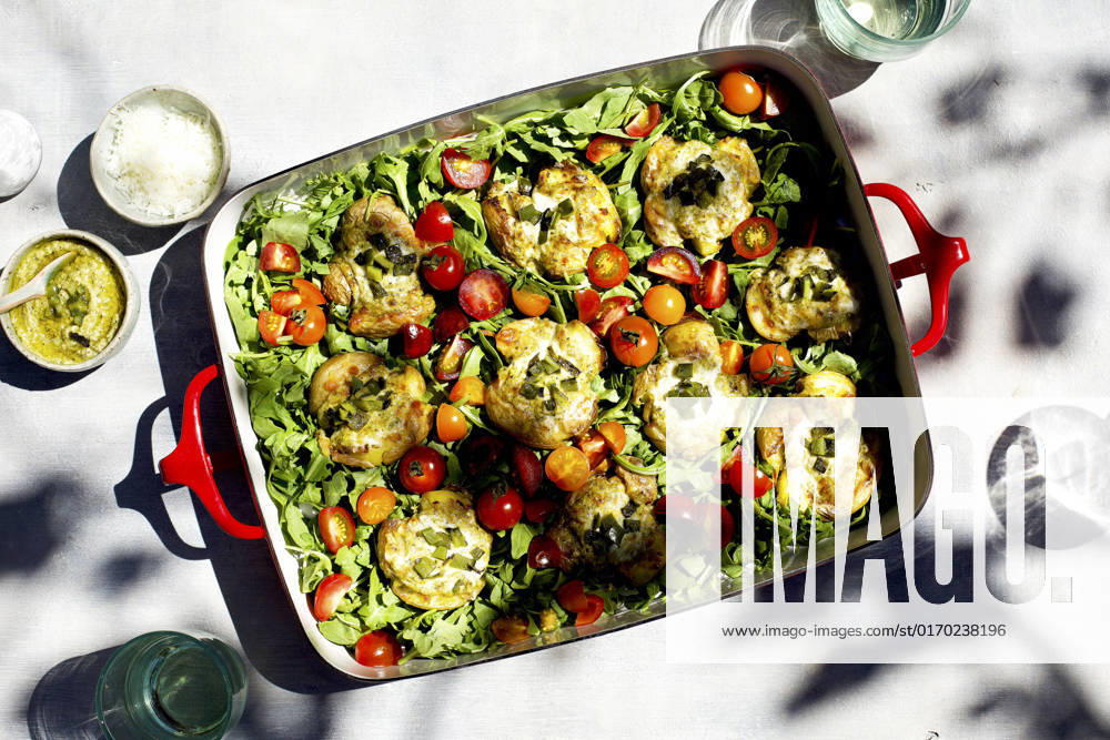 Roasted Poblano Pesto Smashed Potatoes served on a bed of arugula and cherry tomatoes Roasted Poblano Pesto Smashed Potatoes served on a bed of arugula and cherry tomatoes