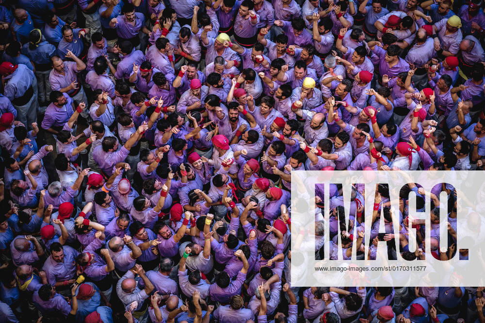 The Colla Jove Xiquets de Tarragona gather to form the base of a human tower during day three of the 28th Tarragona Human Tower Competition in Tarragona. The competition takes place every other year and features the main Castellers teams (colles) of Catalonia during a three day event organized by the Tarragona City Hall - ZUMAo105 20221002_zap_o105_072