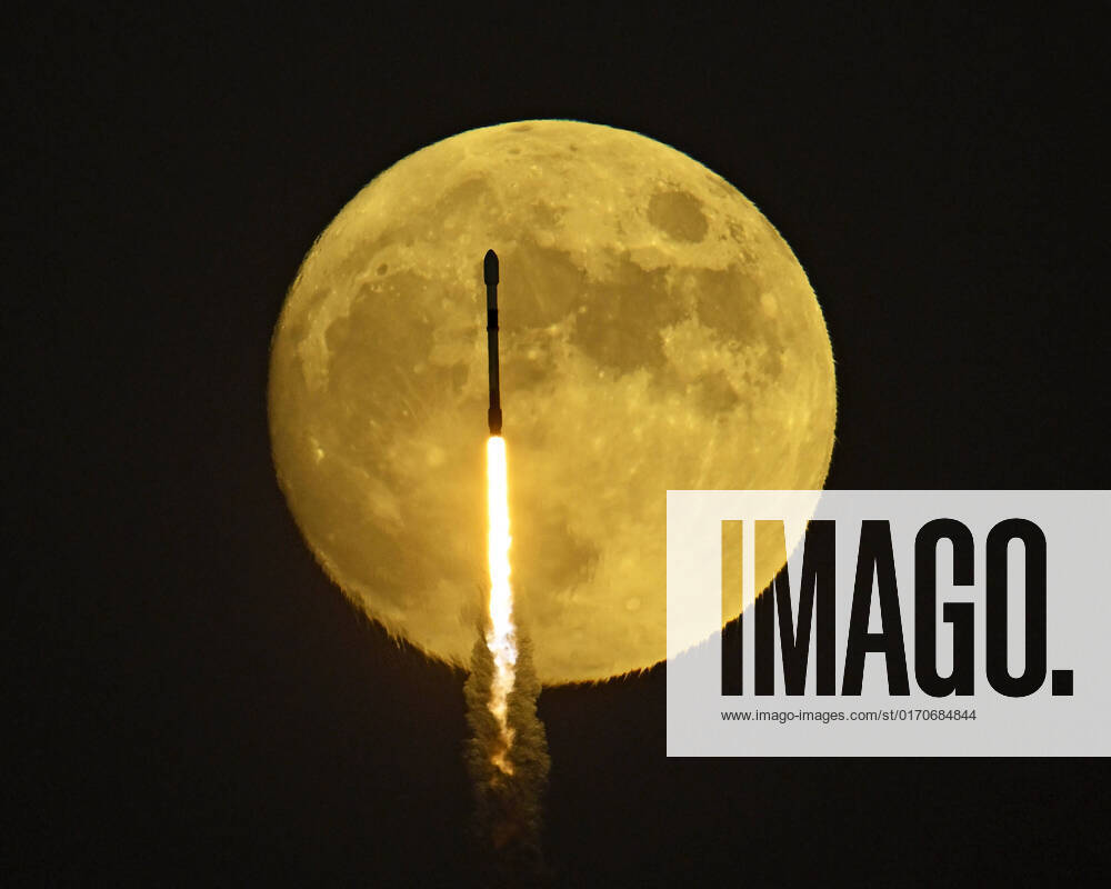 A SpaceX Falcon 9 rocket transits a near full moon as it launches from Complex 40 at the Cape Canaveral Space Force Station, Florida on Saturday, October 8, 2022. On board are two Galaxy Communications Satellites for Intelsat. 1 CCP20221008001 JOExMARINO