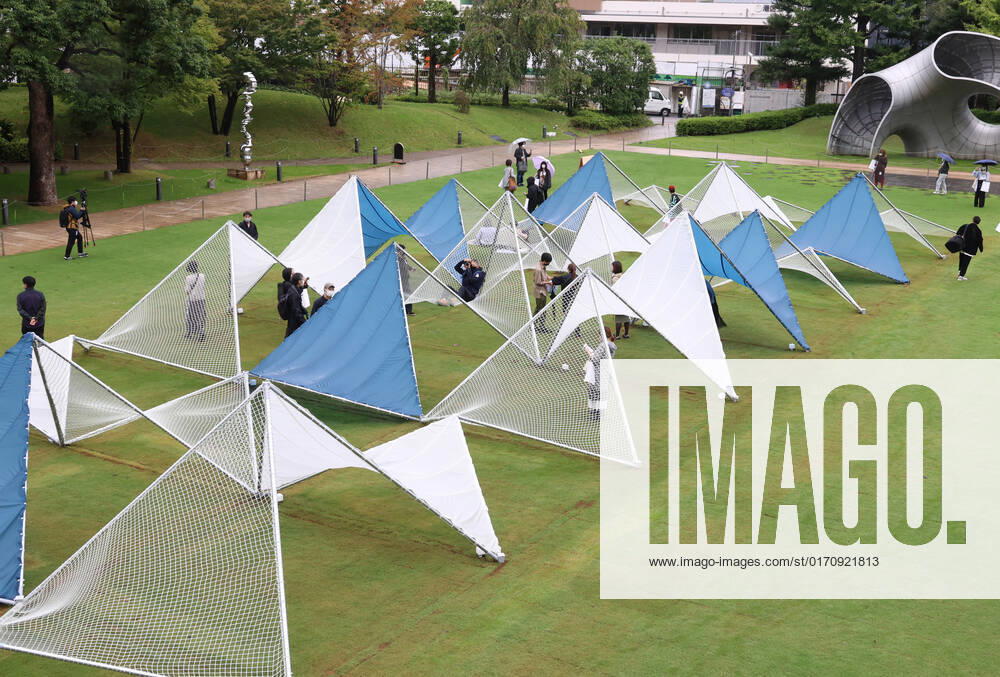 Tokyo, Japan - A large installation Sea Hammock formed by tarps and fishnets created by Japanese architect Yuko Nagayama is displayed on the lawn field as a part of the Tokyo Midtown Design Touch 2022 in Tokyo on Friday, October 14, 2022. An annual design event with the theme of Design for Sustainable Future started at the Tokyo Midtown through November 3. , aflo_201255363.jpg,