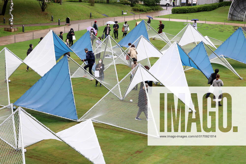 Tokyo, Japan - A large installation Sea Hammock formed by tarps and fishnets created by Japanese architect Yuko Nagayama is displayed on the lawn field as a part of the Tokyo Midtown Design Touch 2022 in Tokyo on Friday, October 14, 2022. An annual design event with the theme of Design for Sustainable Future started at the Tokyo Midtown through November 3. , aflo_201255364.jpg,
