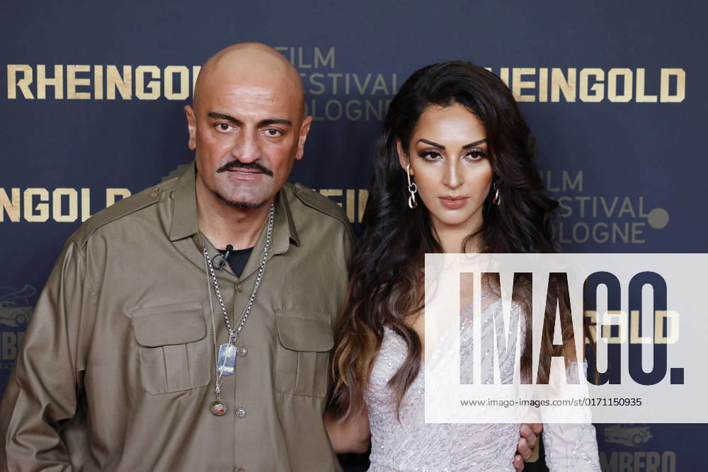 Rapper Xatar Giware Hajabi and model Farvah Heidari at the premiere of Rheingold at the 32 Film Festival Cologne 2022 at Cinedom Cologne, 24 10 2022 NRW Germany.
