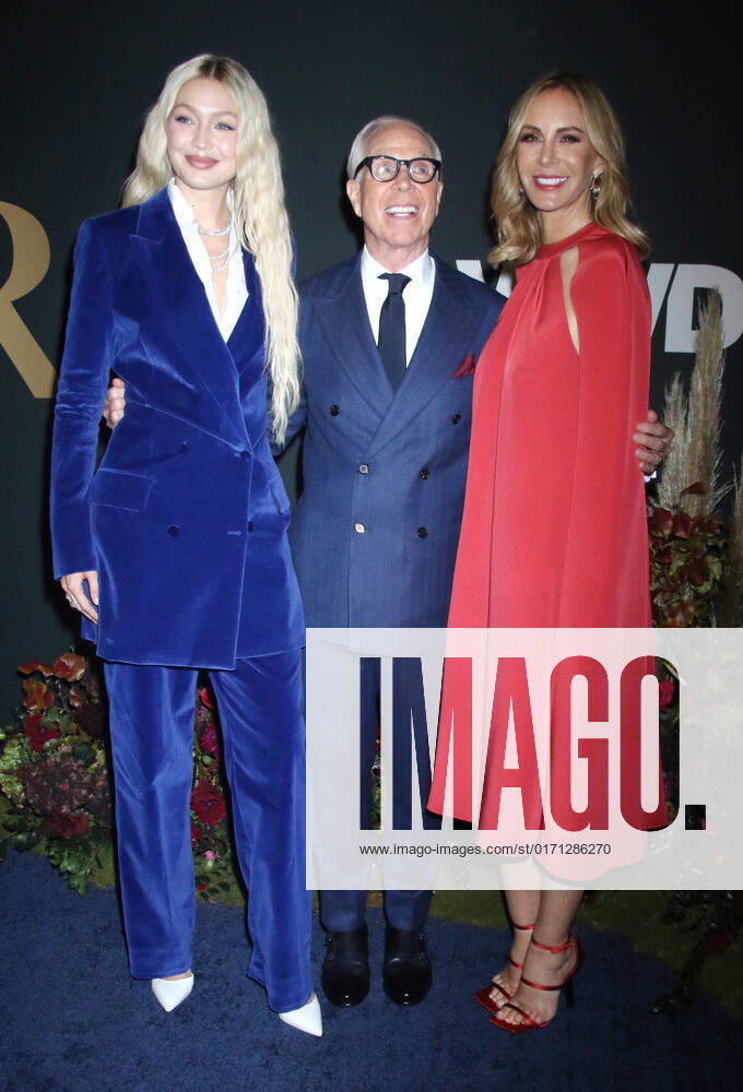 NEW YORK, NY- OCTOBER 25: Gigi Hadid, Tommy Hilfiger and Dee Ocleppo at the WWD 2022 Honors Awards at Cipriani South Street in New York City on October 25, 2022.