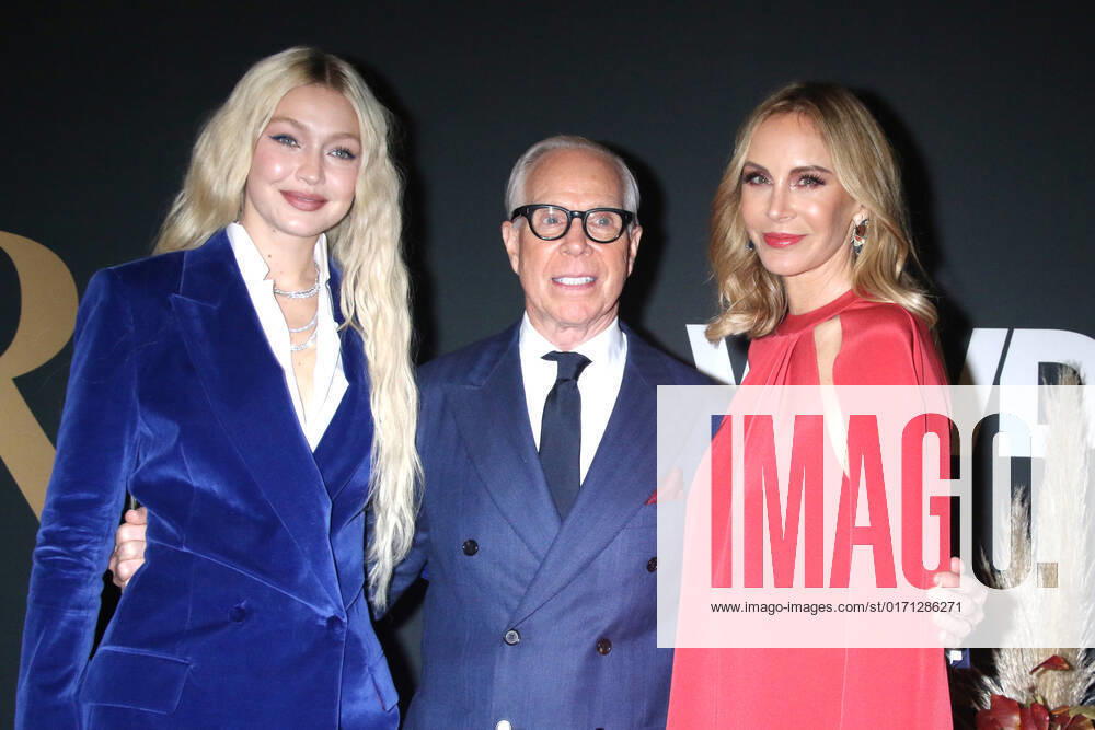 NEW YORK, NY- OCTOBER 25: Gigi Hadid, Tommy Hilfiger and Dee Ocleppo at the WWD 2022 Honors Awards at Cipriani South Street in New York City on October 25, 2022.