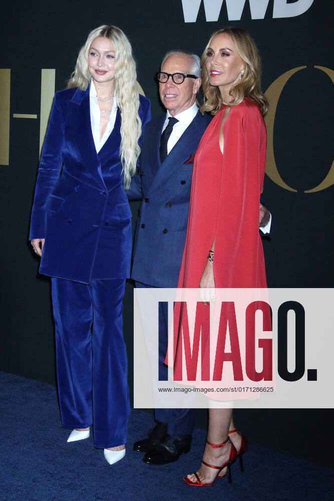 NEW YORK, NY- OCTOBER 25: Gigi Hadid, Tommy Hilfiger and Dee Ocleppo at the WWD 2022 Honors Awards at Cipriani South Street in New York City on October 25, 2022.