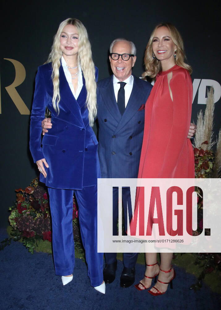 NEW YORK, NY- OCTOBER 25: Gigi Hadid, Tommy Hilfiger and Dee Ocleppo at the WWD 2022 Honors Awards at Cipriani South Street in New York City on October 25, 2022.