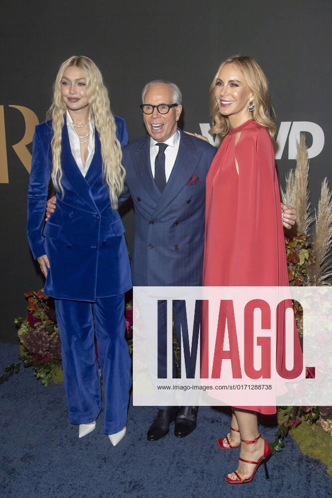 Gigi Hadid, Tommy Hilfiger and Dee Ocleppo Hilfiger attend 2022 WWD Honors at Cipriani South Street in New York City. New York United States - ZUMAs197 20221025_zaa_s197_332