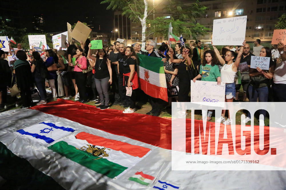 Demonstrators gather to rally against former Israeli Prime Minister Benjamin Netanyahu Demonstrators hold signs and Iranian flags as they protest against the death of Masha Amini and in solidarity with the Iranian protesters on October 29, 2022 in Tel Aviv, Israel. The march coincides with a series of similar events held today in cities around the world, in solidarity with Iranian activists driving a weeks-long protest movement in that country. Photo by Saeed Qaq apaimages Tel Aviv Tel Aviv Israel 291022_APA_SQ_00 (14)
