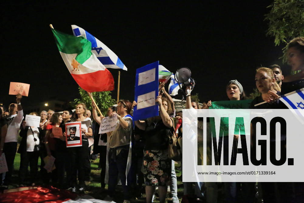Demonstrators gather to rally against former Israeli Prime Minister Benjamin Netanyahu Demonstrators hold signs and Iranian flags as they protest against the death of Masha Amini and in solidarity with the Iranian protesters on October 29, 2022 in Tel Aviv, Israel. The march coincides with a series of similar events held today in cities around the world, in solidarity with Iranian activists driving a weeks-long protest movement in that country. Photo by Saeed Qaq apaimages Tel Aviv Tel Aviv Israel 291022_APA_SQ_00 (2)