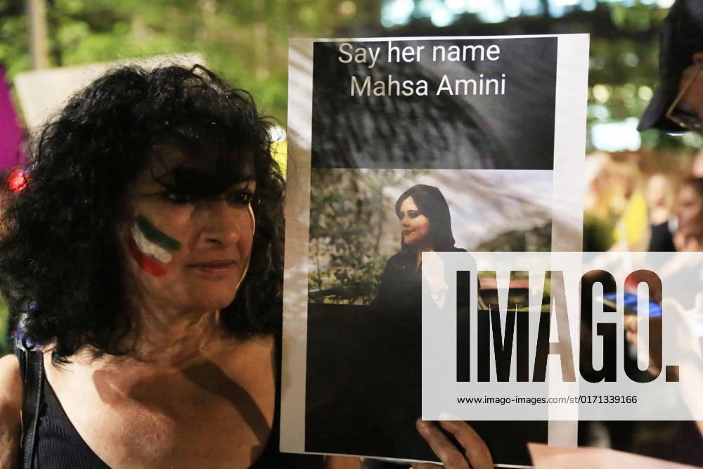Demonstrators gather to rally against former Israeli Prime Minister Benjamin Netanyahu Demonstrators hold signs and Iranian flags as they protest against the death of Masha Amini and in solidarity with the Iranian protesters on October 29, 2022 in Tel Aviv, Israel. The march coincides with a series of similar events held today in cities around the world, in solidarity with Iranian activists driving a weeks-long protest movement in that country. Photo by Saeed Qaq apaimages Tel Aviv Tel Aviv Israel 291022_APA_SQ_00 (4)